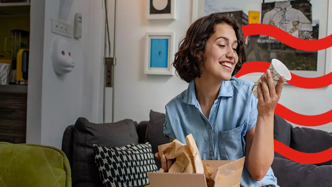 A woman unpacking mugs